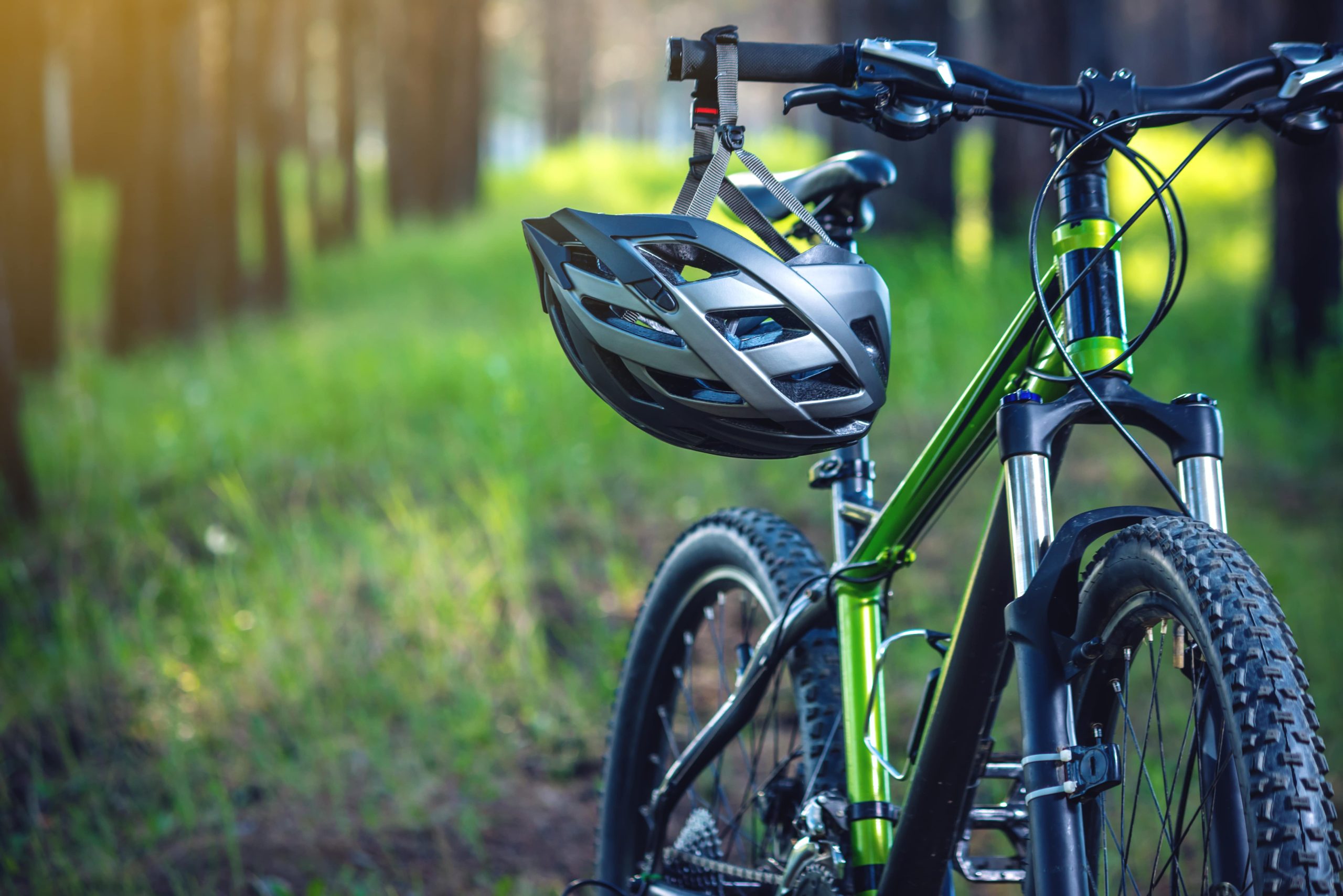 sports helmet green mountain bike park concept protection during active healthy lifestyle min scaled